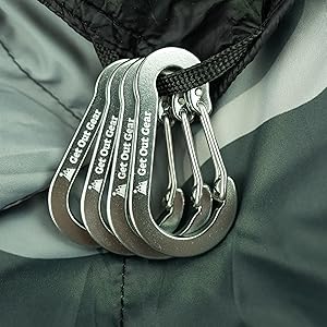 gray get out gear carabiners against gray camo blanket